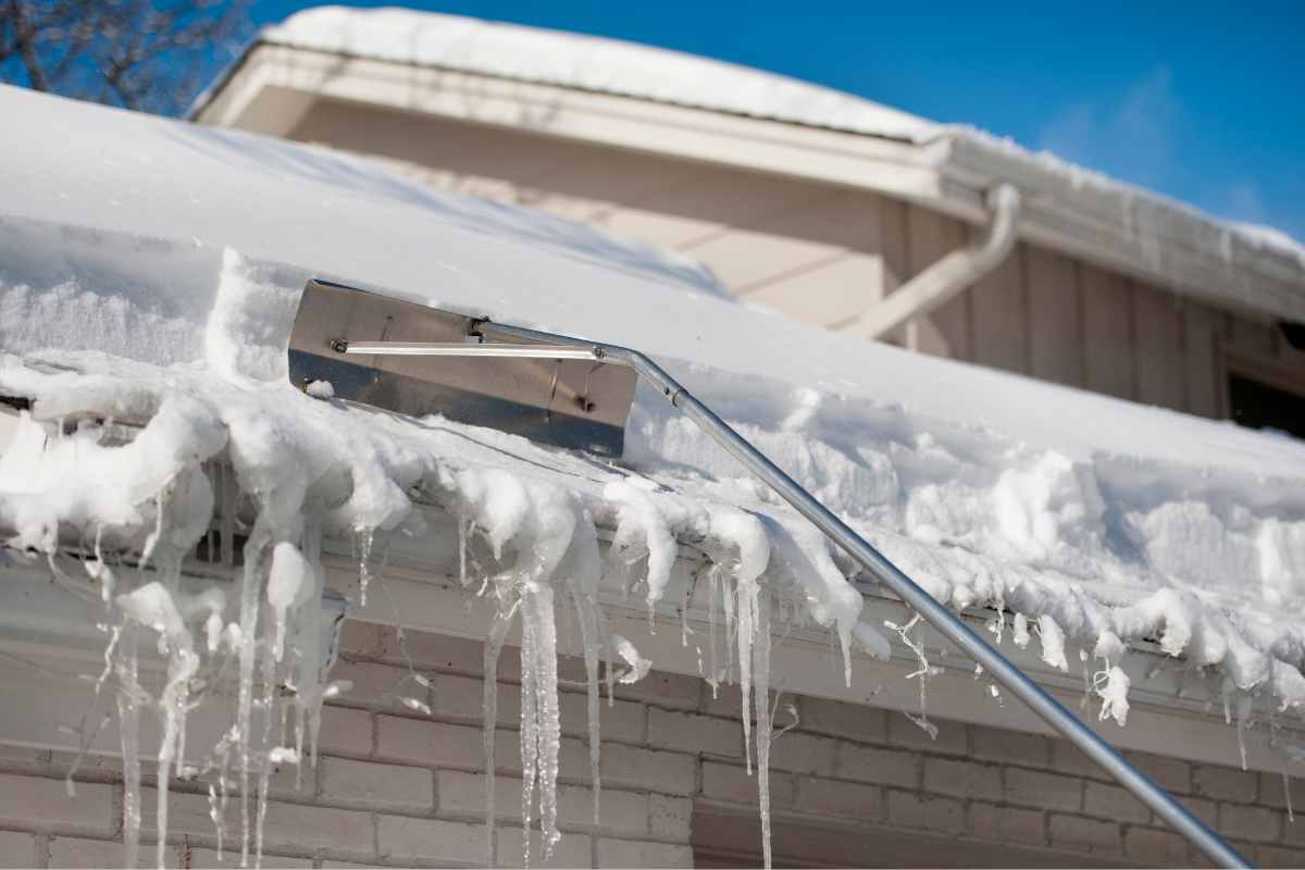 Keeping Winter Woes at Bay: Preventing Ice Dams with Roof and Gutter Maintenance